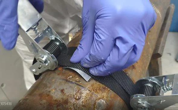 3X FIXOKiT strap tightening a sealing patch on a pipe