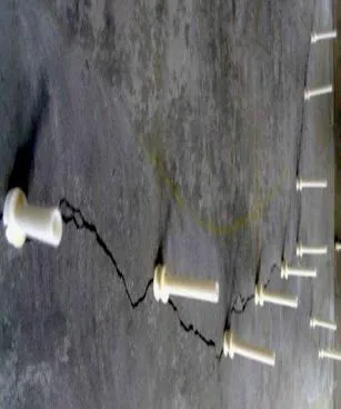 Resin injection ports along a concrete crack
