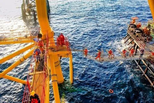 Rope-access technicians working on an offshore structure