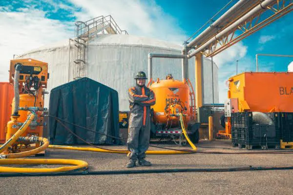 Blasting and coating equipment set up at a storage tank