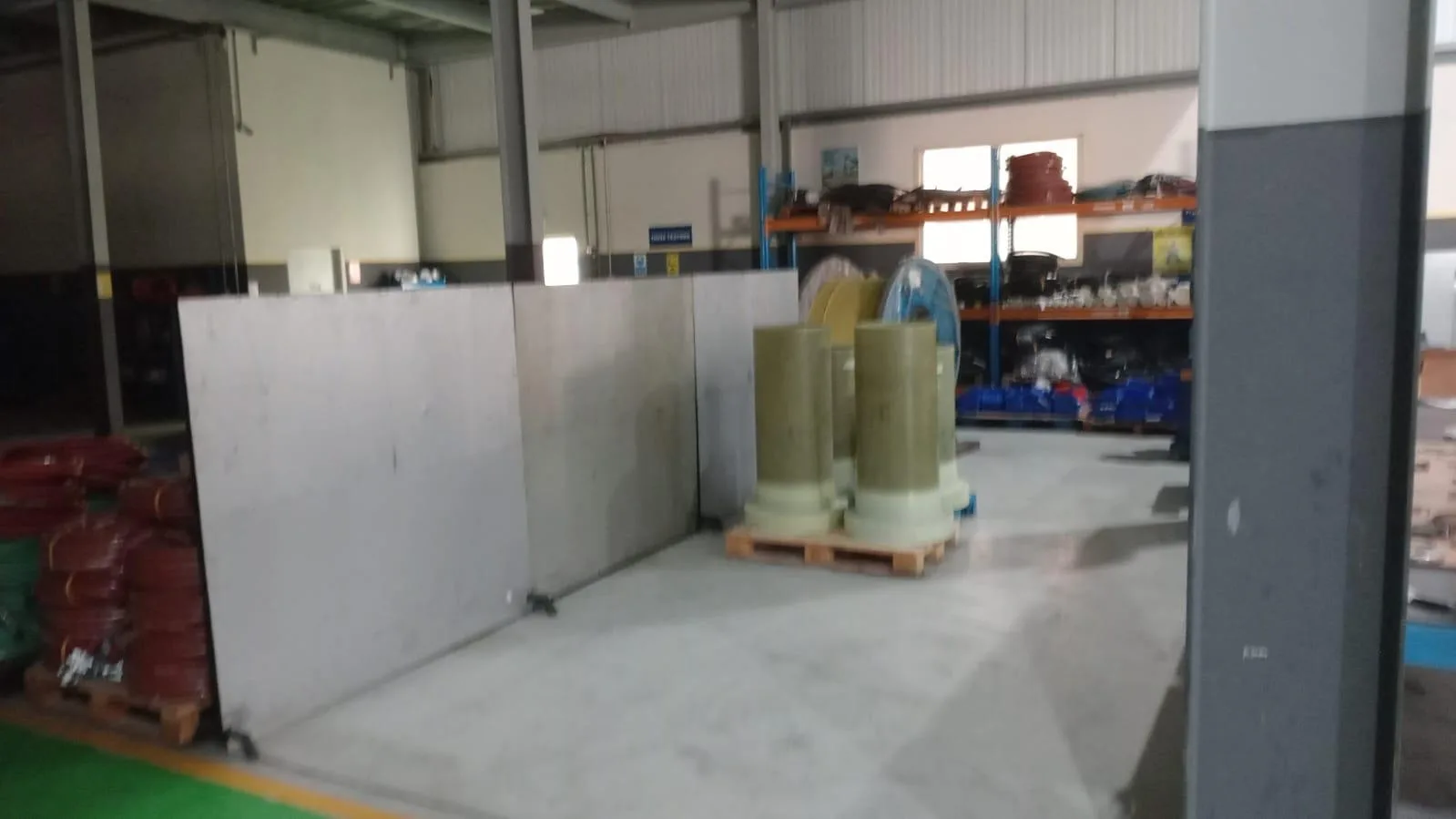 Workshop bay with pipe sections and materials